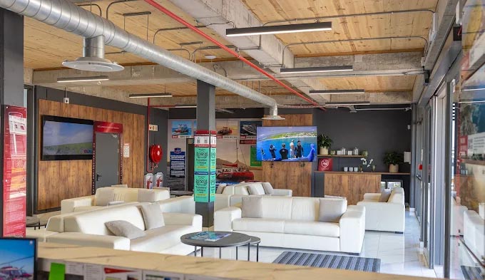 Sport Helicopters luxury airport style lounge with marble floors leather couches client lockers and cash bar